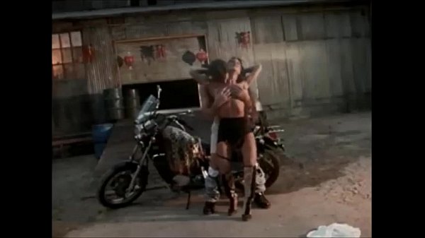ebony babe fucking near a motorcycle